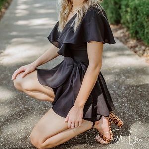 Lulu black open back, wrapped, built in short romper. Doesn’t fit me anymore.